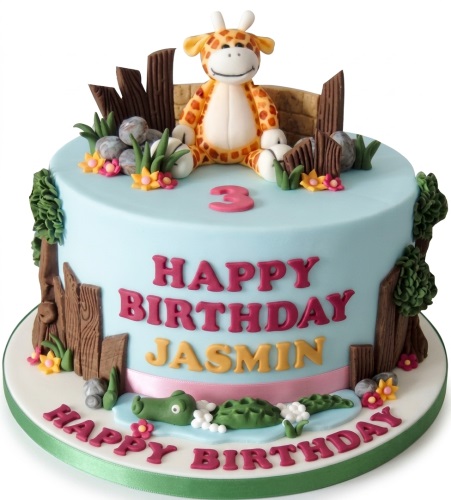 Light blue jungle theme birthday cake with a giraffe, alligator, and custom age topper.